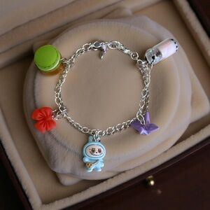 Silver Plated Charm Bracelet with Colorful Charms; 7 inches.